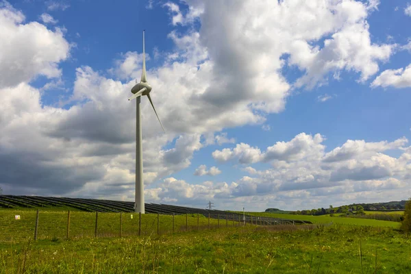 Single Wind Turbine On farmland concept of clean energy production