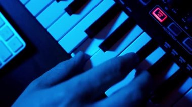 Male Hand Playing Midi Keyboard