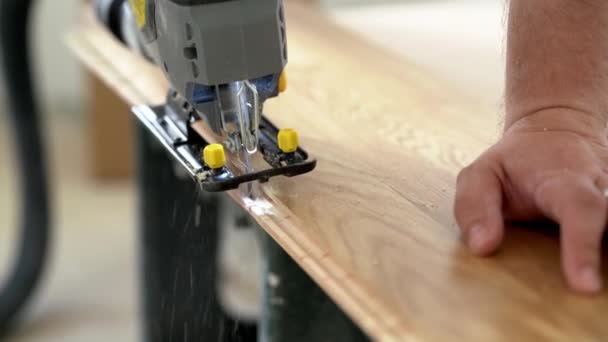 Worker Cuts Parquet Floor Board Jigsaw — Stock Video