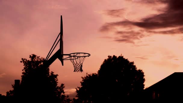 Silhouette Ball Goes Basketball Hoop Slow Motion — Stock video