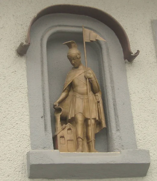 Ukraine, Mukachevo, a statue of a warrior on the wall of a house