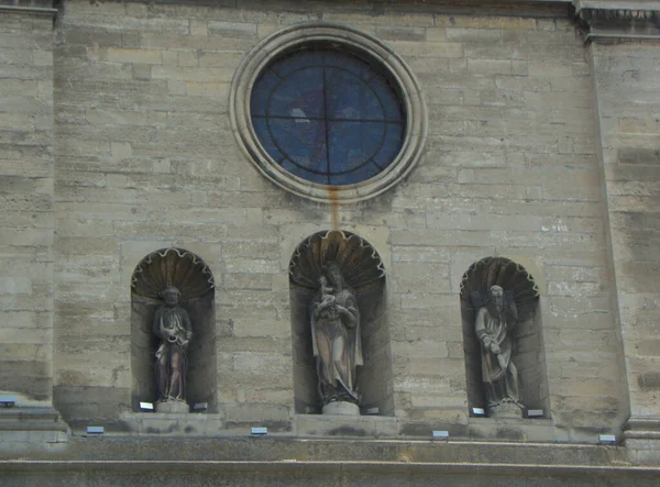 Ukraine, Lviv, Cathedral Square, Bernardine church, sculptures of St. Peter, the Mother of God and St. Andrew on the facade of the church