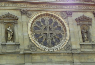 France, Paris, Boulevard des Invalides, St Francis Xavier's Church, stained-glass window and two statues on the facade of the church