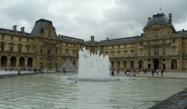 France, Paris, Place du Carrousel, the Louvre Palace and fountain