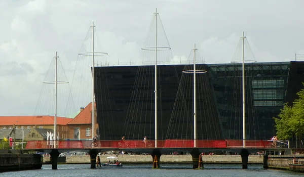 Denmark, Copenhagen, port of Copenhagen, view of the Five Circles Pedestrian Bridge and the Black Diamond building from the ship