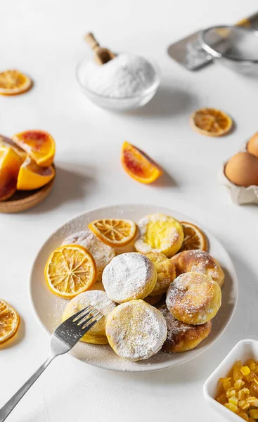 Cottage cheese pancakes with ingredients: gluten free flour, maple syrup, oranges peels, eggs — Stock Photo, Image