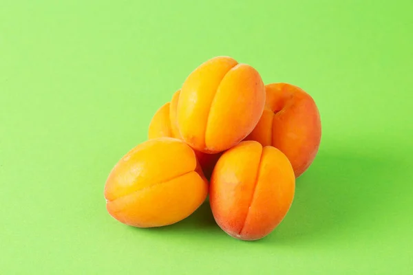 Group Fresh Ripe Apricots Bright Green Background — Stock Fotó