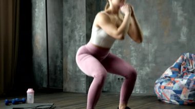 beautiful athletic girl does the right exercise on her legs