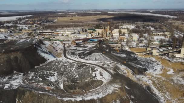 Aerial shot of factory for a fossil extraction. Drone flying over pit of industrial mining. Ecology and environmental pollution problem. Concept of production and manufacture. Dolly shot — Stock Video