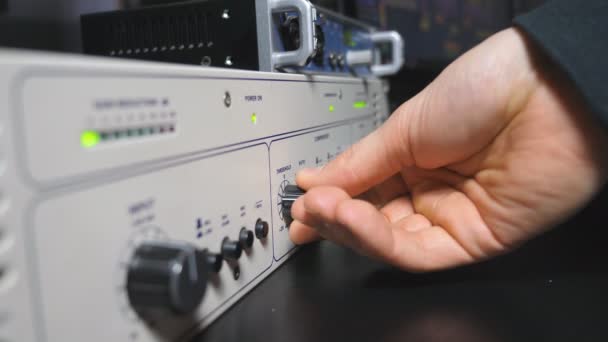 Male Hand Sound Engineer Cranking Volume Knobs Control Mixer Panel — Vídeo de Stock