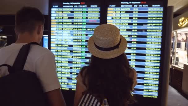 Young Couple Looking Flight Schedule Airport Pair Checking Airline Departure — Video