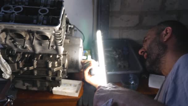 Attentive Mechanic Fixing Automobile Engine Garage Workshop Man Using Bright — 비디오