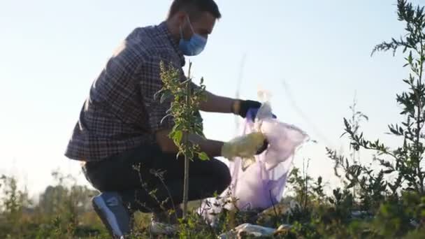 Male Eco Activist Gloves Collecting Trash Bag Countryside Young Volunteer — Stock Video