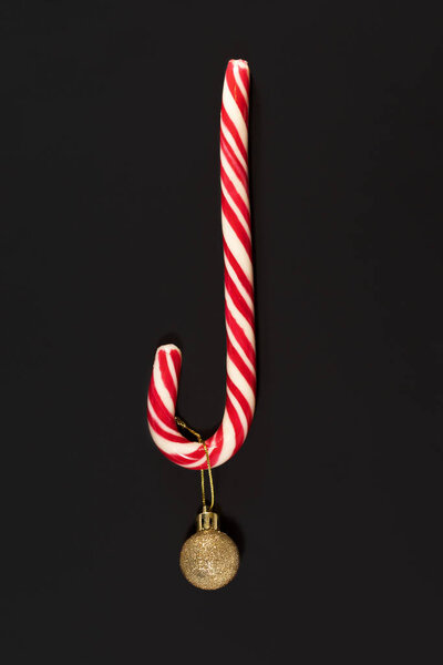 Christmas candy cane isolated on black background.Christmas holidays concept.