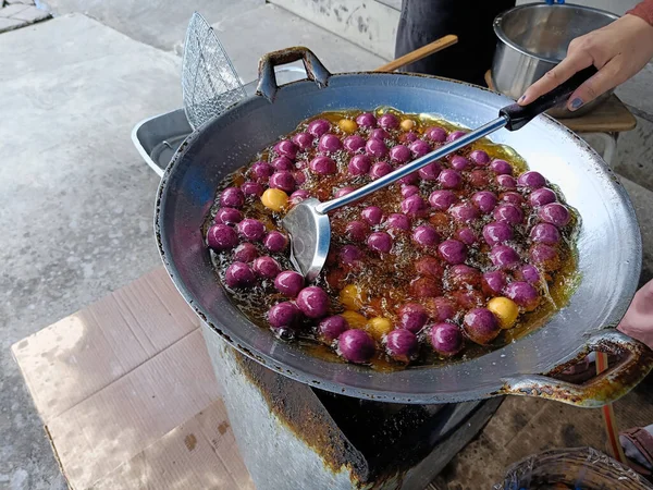 Cooking Sweet potato ball or Thai call Khanom khai nok kratha. made from sweet potatoes and flour mold ball sphere