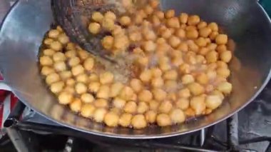 Cooking Sweet potato ball or Thai call Khanom khai nok kratha. made from sweet potatoes and flour mold ball sphere