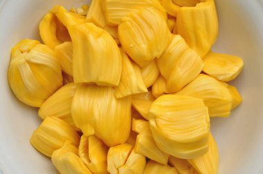 Jackfruit on white dish, tropical fruit background