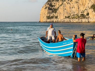 Blue tour boat floating on the Mediterranean sea