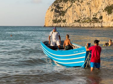 Blue tour boat floating on the Mediterranean sea