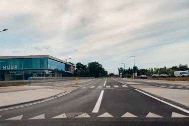 Car window view over the roadside of a freeway in Belgium