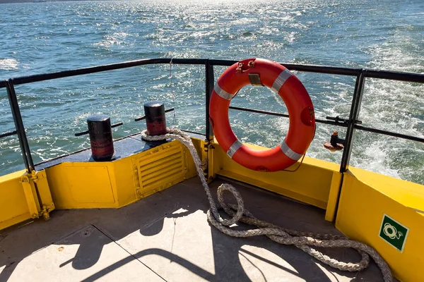 Orange rescue ring on a ferry boat in Lisbon