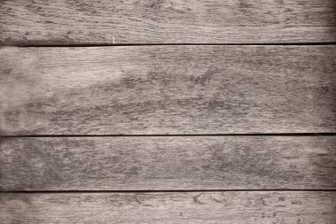 Gri, ahşap bir arka plan ve yazı için yer var. Yatay duvar kağıdı ve maketi. Uzay konseptini, duyuruyu, kartpostalı kopyala. Yüksek kalite fotoğraf