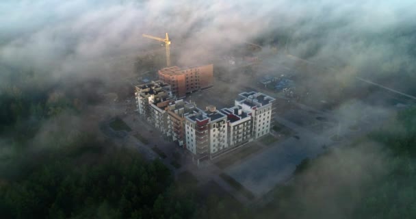 Top view through the fog on the construction of a residential complex