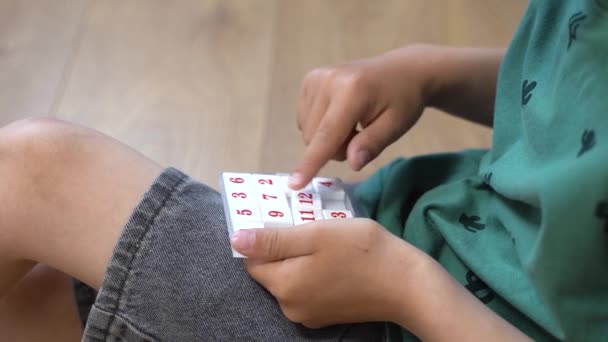 Child Solves Puzzle Close — Stock Video