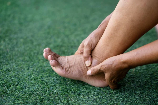 Closeup Elderly Hands Massage Her Painful Ankle Because Sprain Concept — Stock Photo, Image
