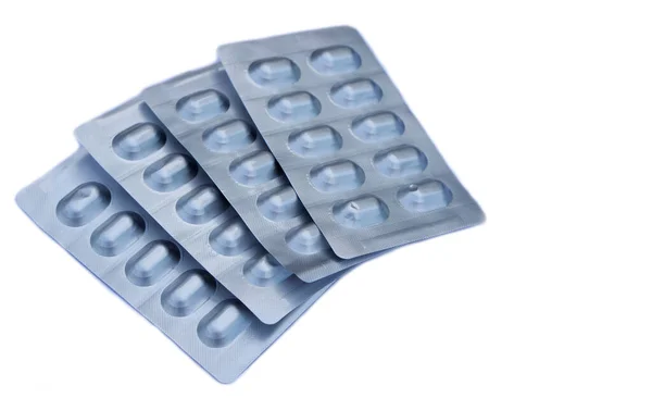 Négy Ezüst Alumínium Buborékcsomagolás Kapszula Tabletták Gyógyszert Izolált Fehér Alapon — Stock Fotó