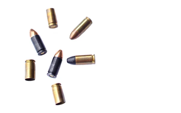 9mm pistol  gun bullets and cartridge cases isolated on white background.  Flat lay. Space for text. Concept : dangerous weapon for shooting.    