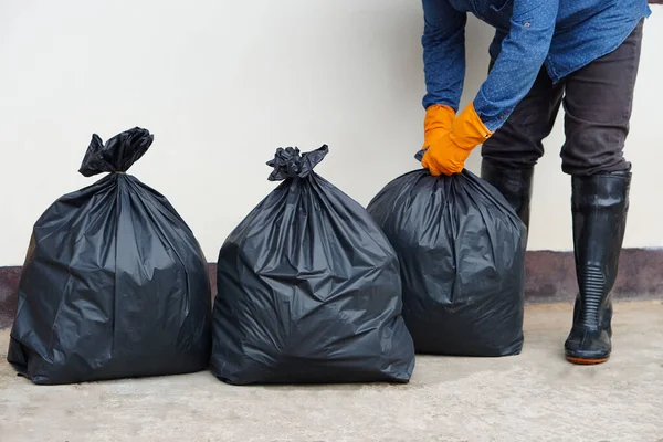 Closeup Man Holds Black Plastic Bag Contains Garbage Concept Waste — Stok Foto