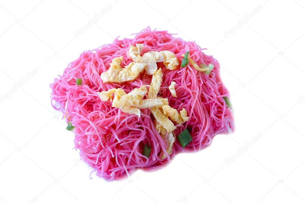 Closeup stir fried pink noodle ,topping with sliced omelet and vegetable, isolated on white background. concept : Thai traditional food. Street food in Thailand.               