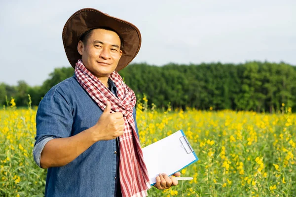 Handsome Asian Man Farmer Flower Garden Holds Paper Notepad Thumbs — Foto de Stock