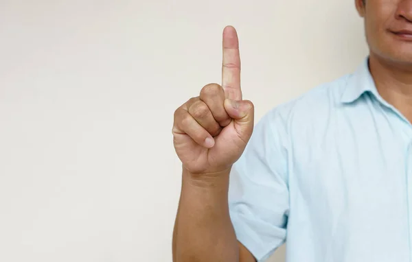 Closeup man shows hand sign gesture to communicate. Concept : Body sign Language to teach or communicate with deaf disabled. Education for handicaps .