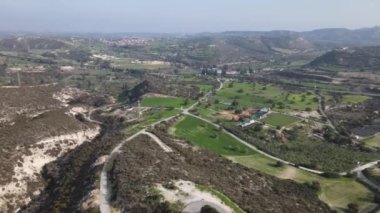 Types of Cyprus in the mountains. Top view of the mountains and human structures. Diverse landscape in nature.
