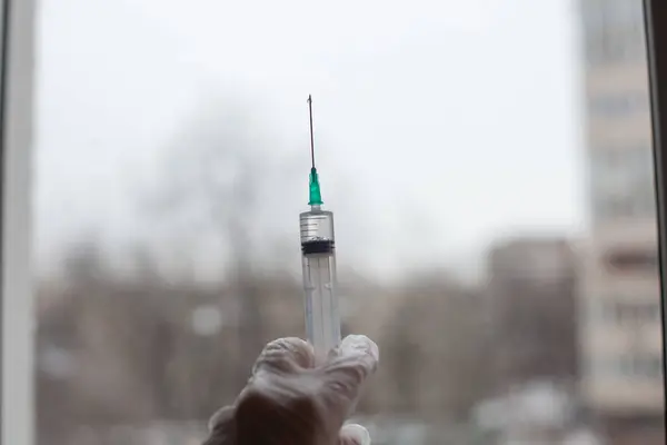 Doctor Holding Syringe Front Window Needle — Stock Photo, Image
