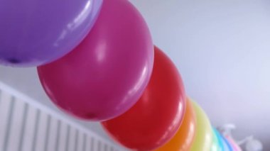 Rainbow balloons decorations for birthday party. Pride word. LGBT rights and gender equality