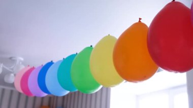 Rainbow balloons decorations for birthday party. Pride word. LGBT rights and gender equality