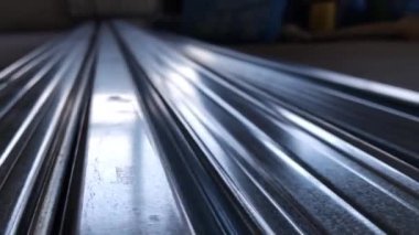 Metal profiles. Stack of stainless steel pipes in warehouse. Rolled metal products. Economic Metals list prices index. Financial crisis. Wall building parts.