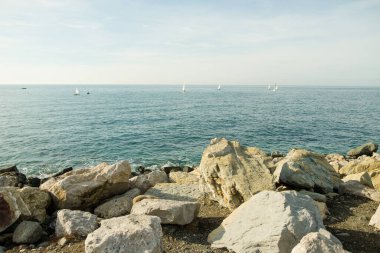 Sea Waves On Rocky Beach, beautiful close-up footage of a sea waves washing up beach pebbles. Beutiful coastline, horizontal. Waves are reaching pebble beach