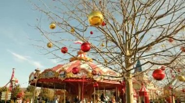 Sochi, Russia - January 02 2022: Colorful Carousel Attraction Ride With Wooden Horses. Childrens carousel of attractions in the Sochipark amusement park