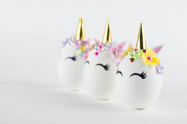 Easter unicorn eggs isolated on white background. Happy easter banner. Kids activity inspiration. Greeting card or poster. Copy space for text