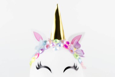 Easter unicorn head egg isolated on white background. Happy easter banner. Kids activity inspiration. Greeting card or poster. Copy space for text
