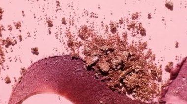 Cosmetics swatches. Peach, beige, red and coral toned styled cosmetics flat lay. Closeup lipstick and shadows colour palette. Creative concept cosmetics samples. Beauty products on pastel background