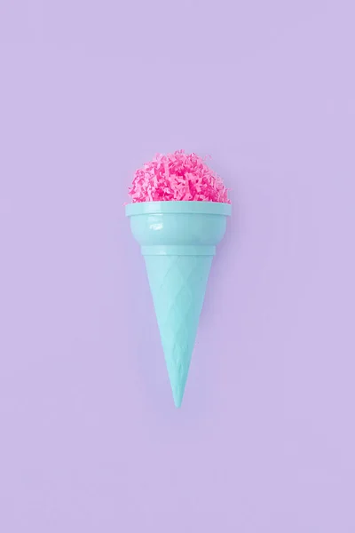 Pink paper ice cream scoop with ice cream plastic cone on bright purple background. Minimal summer concept. Micro plastic in food. Recycling