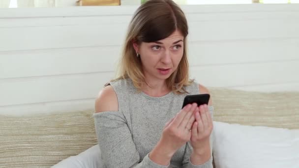 Girl Looks Phone Very Surprised What She Sees Embarrassment Surprise — Stockvideo