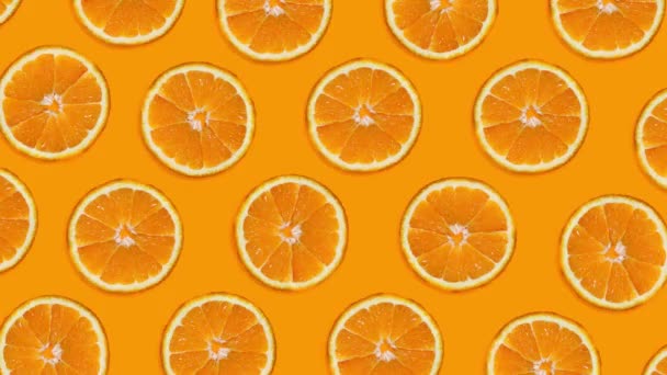 Hintergrund Auftauchende Und Verschwundene Orangenscheiben Auf Orangefarbenem Hintergrund Blinkender Hintergrund — Stockvideo