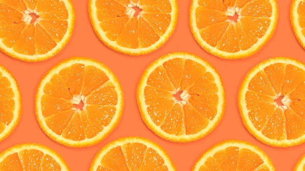 Seamless pattern with orange slices on a warm background. Fruity background, with juicy citrus pieces. Summer background