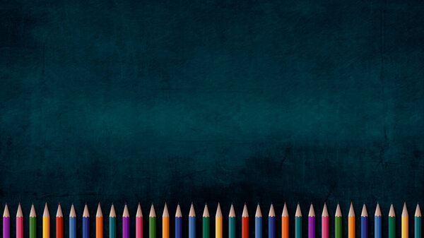 Обратно в школу. Набор цветных карандашей на фоне доски